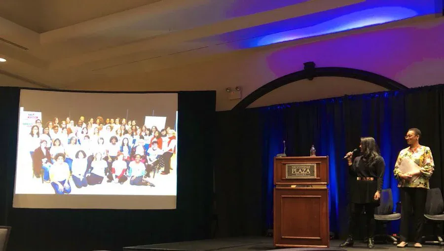 Jareen Imam speaking about Women Do News at a conference